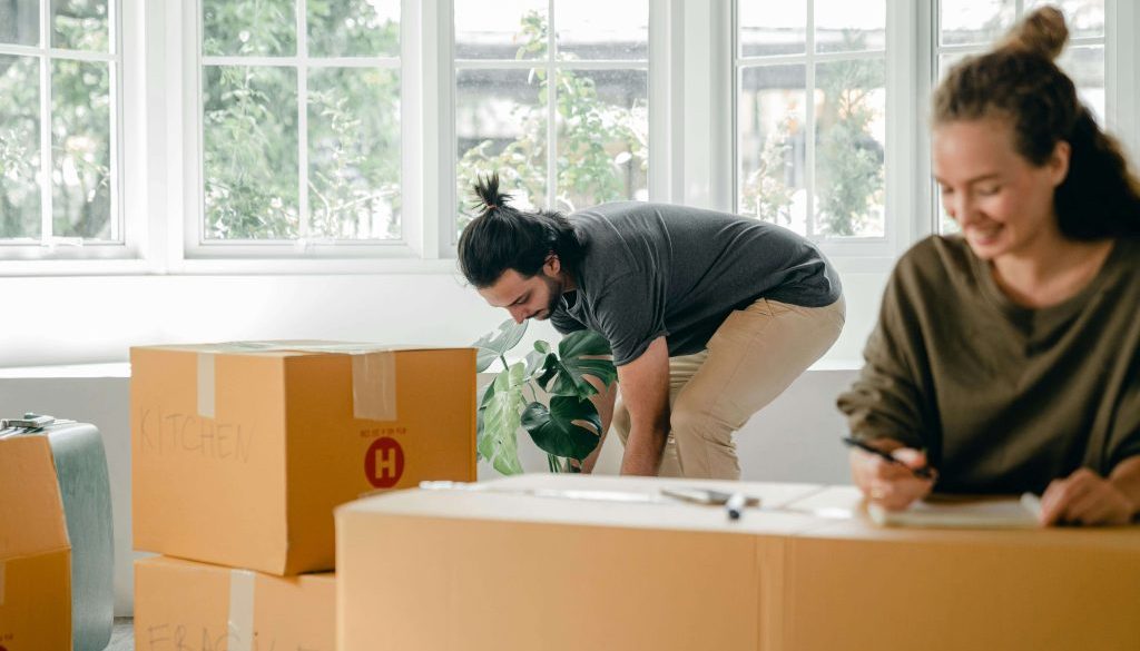 couple organising moving boxes