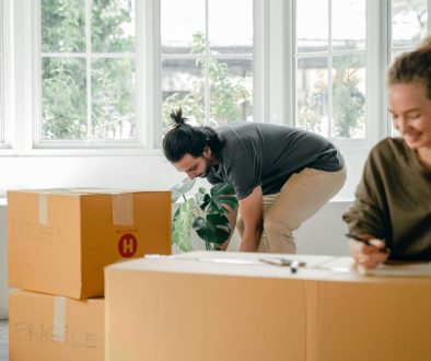 couple organising moving boxes