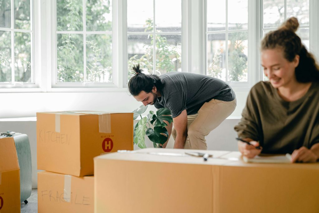 couple organising moving boxes